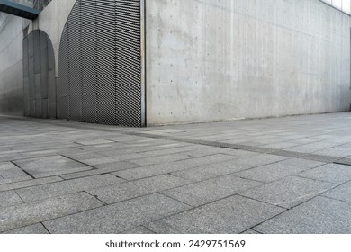 empty concrete floor in front of modern buildings in the downtown street. copy space for parking lot.