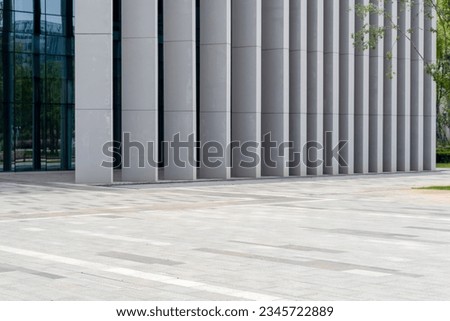empty concrete floor in front of modern buildings in the downtown street.