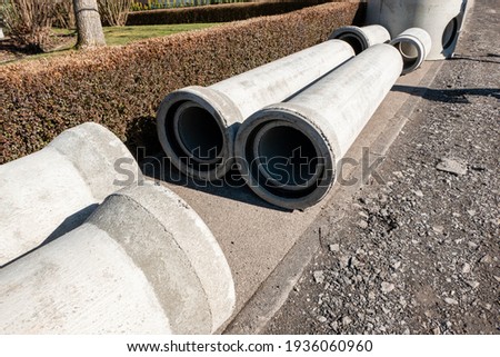 Empty concrete pipes for sewerage on the construction site