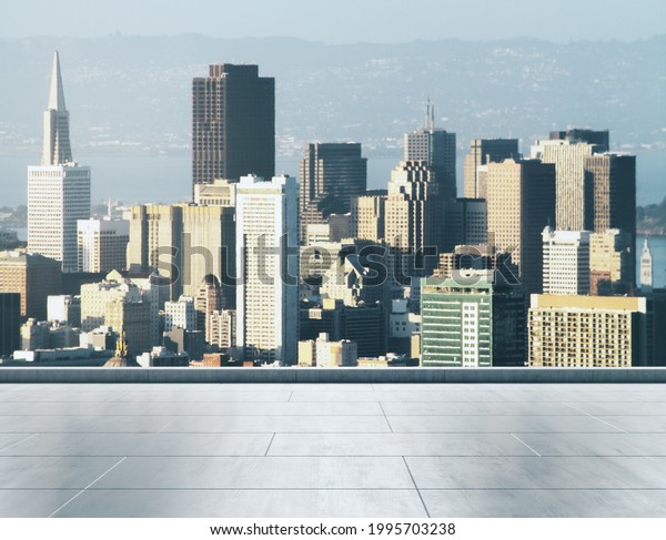 Empty concrete rooftop on\
the background of a beautiful San Francisco city skyline at sunset,\
mockup
