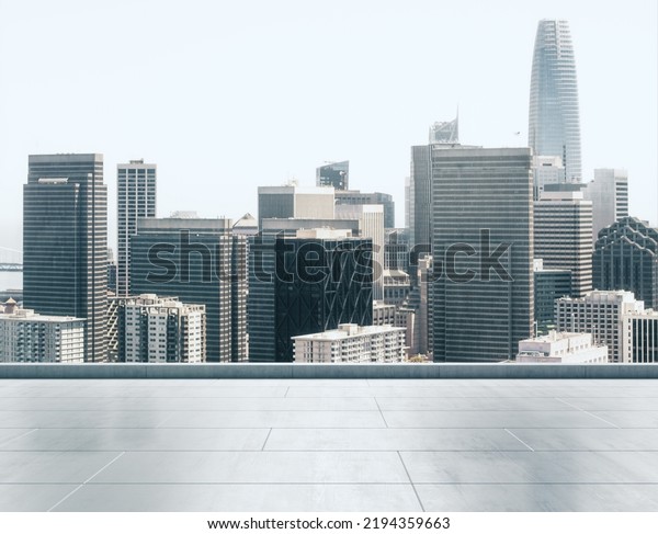 Empty concrete rooftop on\
the background of a beautiful San Francisco city skyline at sunset,\
mockup