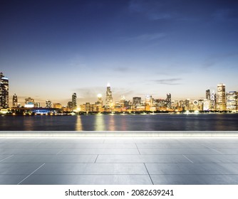 Empty concrete seafront on the background of a beautiful blurry Chicago city skyline at twilight, mockup