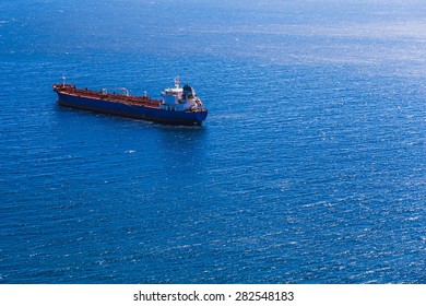 Empty Container Cargo Ship In The Open Ocean Or Sea