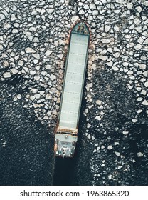 Empty Container Ship Breaking The Ice In Sea, Birds Eye View