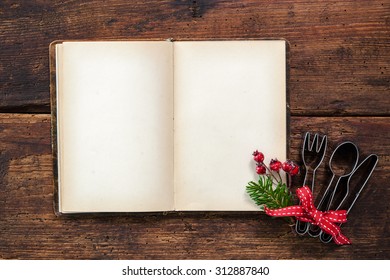 Empty Cookbook For Christmas Recipes On Wooden Table