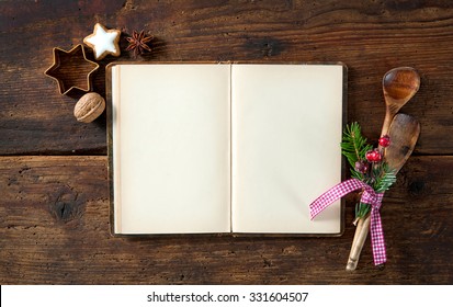 Empty Cookbook For Christmas Recipes On Wooden Table