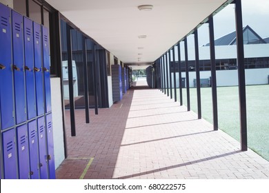 Empty corridor at school during sunny day - Powered by Shutterstock