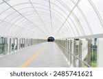 empty corridor in the white tunnel.Walking down the corridor walkway to train.