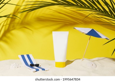 Empty Cosmetic Skin Care Cream Or Sun Block On Sand Beach With Yellow Background Travel Vacation Accessory