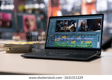 Empty creative office for videographers and editors featuring modern work setup with digital editing tools. The video editor software ensure movie montage for content creation.