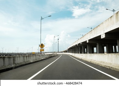 Empty Curved Asphalt High Way Road In Bali. Empty Highway Road Of Bali. Curve Of High Way Road. Road Bridge Surrounded By Sea. 