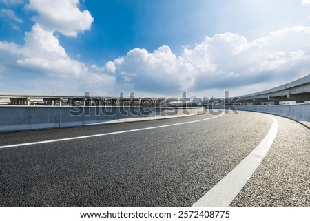 Empty curved highway and sky cloud background