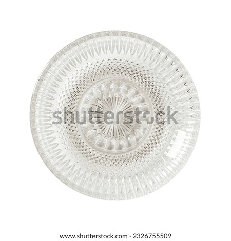 Empty cut glass dessert plate cutout. Beautiful vintage glass saucer isolated on a white background. Modern glass tableware. Empty plate concept. Crockery for food design. Top view.