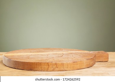 Empty cutting board on a wooden table close up
