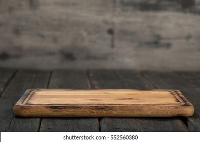 Empty Cutting Board On A Wooden Table Close Up