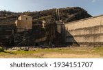 empty dam next to the mountain