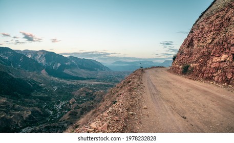 Empty dangerous narrow cliffside  mountain road. Dangerous off road driving along mountain edge and steep cliff. Dagestan. - Powered by Shutterstock