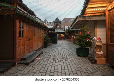 Empty Dark Alley With Closed Sale Stalls Before The Opening Of The Christmas Market, Hoping The Event Is Not Canceled Due To Covid-19 Pandemic, Copy Space, Selected Focus, Narrow Depth Of Field