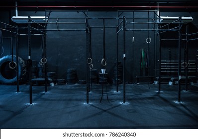 Empty dark rings and chin bar room at gym