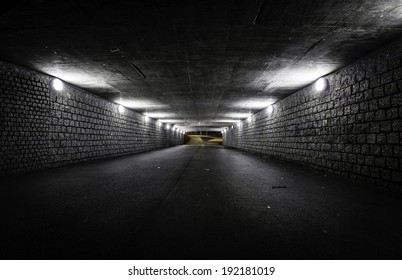 Empty dark tunnel at night - Powered by Shutterstock