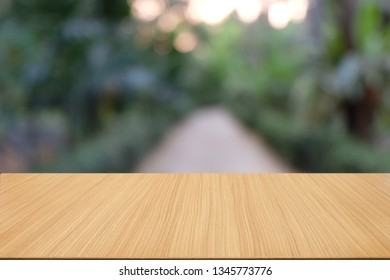 Empty dark wooden table in front of abstract blurred bokeh background of restaurant . can be used for display or montage your products.Mock up for space. - Shutterstock ID 1345773776