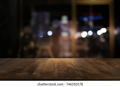 Empty dark wooden table in front of abstract blurred bokeh background of restaurant . can be used for display or montage your products.Mock up for space - Shutterstock ID 746310178