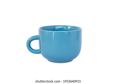empty decorative blue and turquoise cup isolated white background. modern glass for tea, coffee, or milk. Shiny bright color glazed vintage handmade mug for drinking water with one handle - Shutterstock ID 1953640915