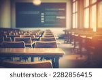 Empty defocused university classroom. Blurred school classroom without students with empty chairs and tables. Business conference room