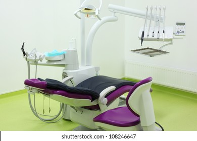 Empty Dental Clinic. Big And Comfortable Chair For Patient, Chair And Tools For Dentist.