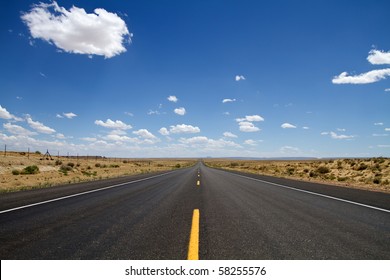 Empty Desert Road Stretching In New Mexico USA