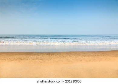 Empty deserted beach with clean blue sky