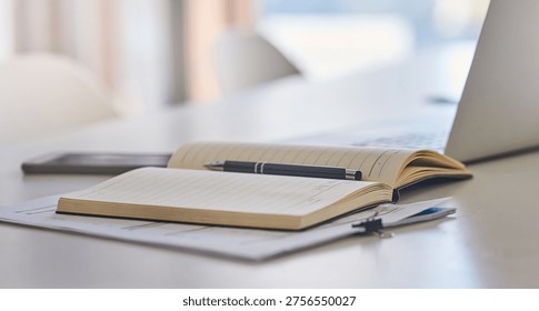Empty, desk and documents with notebook in office for research notes, journalism schedule and to do list. Journal, laptop and paperwork at publishing agency for source info, news planner and agenda