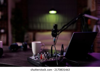 Empty Desk With Podcast Equipment To Record Live Talking Show At Home. No People In Living Room Used For Online Vlogging And Broadcasting Conversation With Microphone, Sound Production.