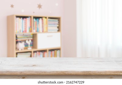 Empty desk for product display on defocused children room background - Shutterstock ID 2162747229