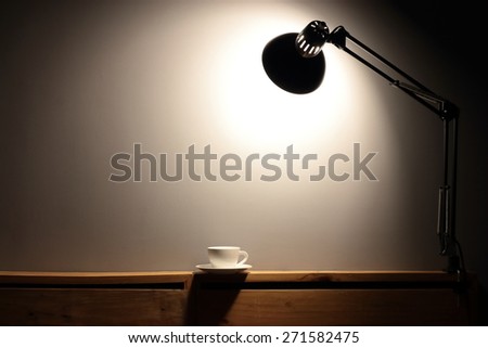 Empty desk and wall.