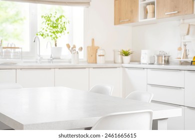 Empty dining table with chairs in modern kitchen furniture interior of pastel color - Powered by Shutterstock