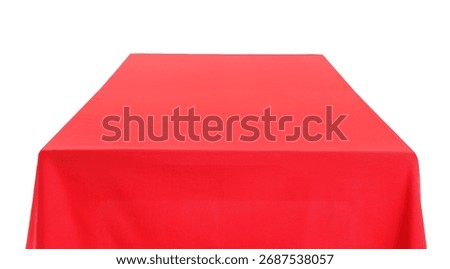 Empty dining table with stylish red tablecloth isolated on white background