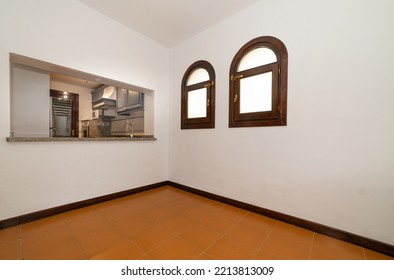 Empty Dinning Room Area In An Apartment Next To The Kitchen And With Two Windows 