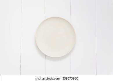 Empty Dish On Wooden White Table, Top View