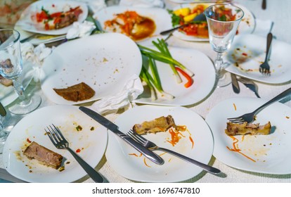 Empty Dishes After Family Dinner In Restaurant. Party, Celebration Or Healthy Food Concept.