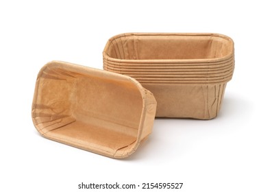 Empty disposable rectangular brown paper baking molds isolated on white