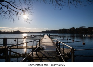 Empty docks in the port of Scharmuetzelsee, Brandenburg, Germany. Empty docks in winter under the clear sky at noon.