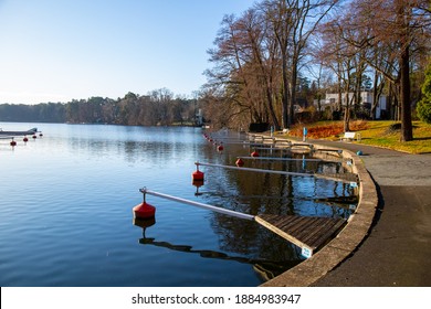 Empty docks in the port of Scharmuetzelsee, Brandenburg, Germany. Empty docks in winter under the clear sky at noon.
