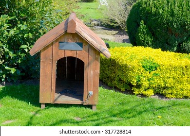 A Empty Dog Kennel In A Home Garden 