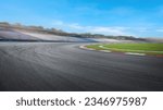 Empty Dramatic view of racing circuit asphalt road with blue skyline