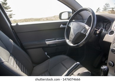 Empty Driver Seat And A Steering Wheel Of The Car