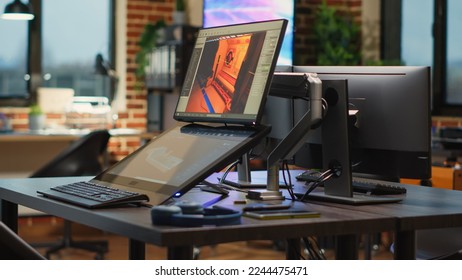 Empty electronics with multiple screens to develop artistic modern content, showing gaming software on display. Empty programming studio running infographics interface on computers. - Shutterstock ID 2244475471