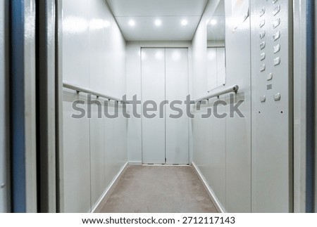 Empty Elevator Cabin With Stainless Panels And Bright Ceiling Lights, Control Buttons On Side Wall, NonSlip Flooring, Commercial Service Lift Vibe, MaintenanceReady Atmosphere, Safety Signage Ready,