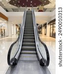 Empty escalator metal steps inside of building