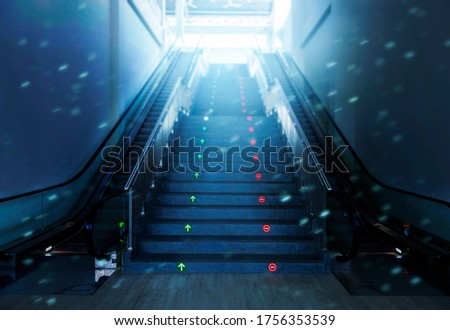 Empty escalator and stairs with dramatic light background